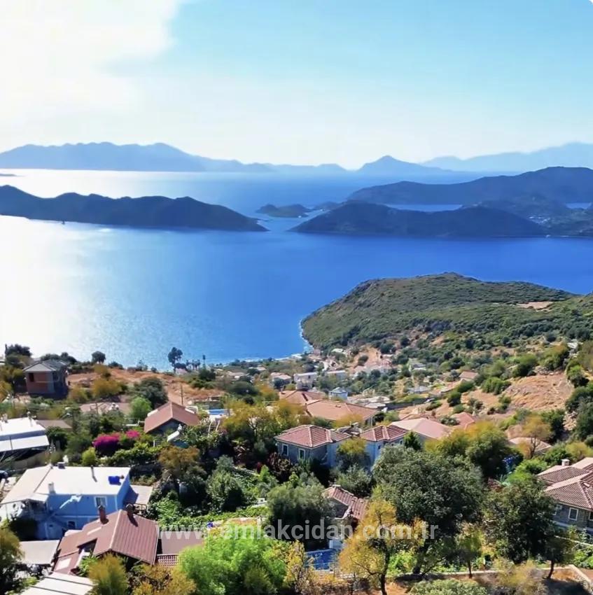 Söğüt köyünde Simi adası ve deniz manzaralı ekolojik turizm İmarlı 2100 m2 tarla