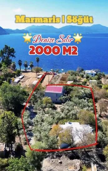 Marmaris Söğüt köyünde denize sıfır 2000 m2 yalı dairesi