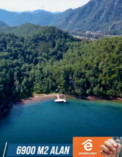 Marmaris Orhaniye mahallesinde 6000 m2 Özel İskelesi mevcut satılık koy