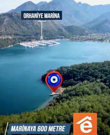 Marmaris Orhaniye mahallesinde 6000 m2 Özel İskelesi mevcut satılık koy